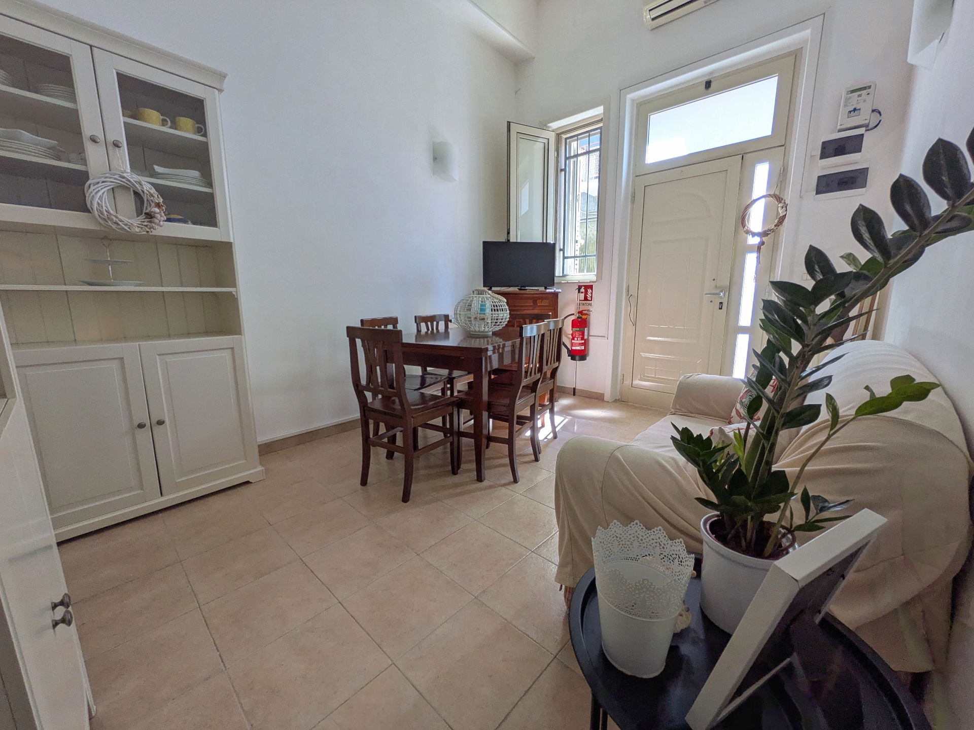 Bright living room with dining area and wooden furnishings